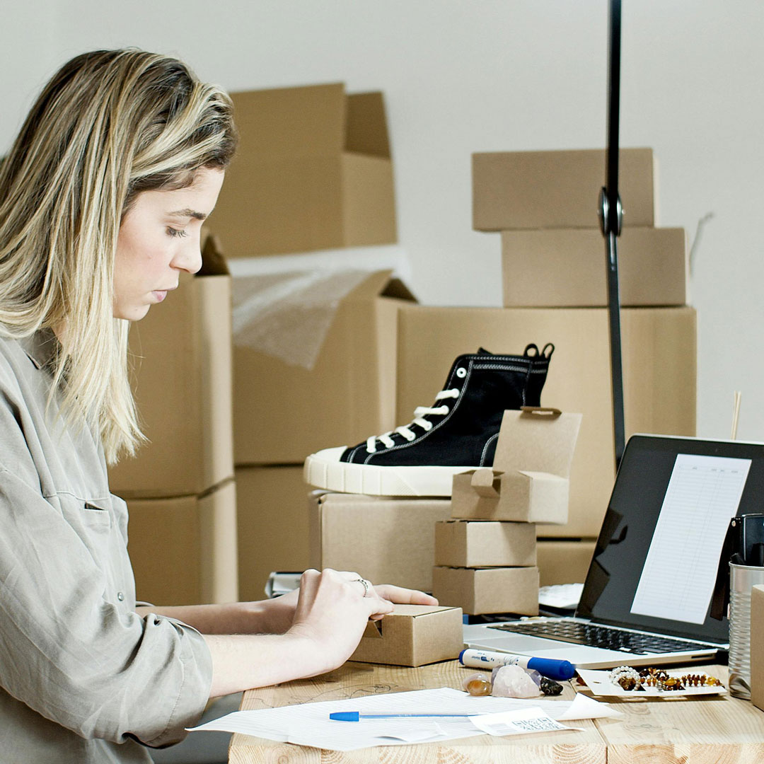 Professional UX/WebDev Services / Businesswoman working in her warehouse