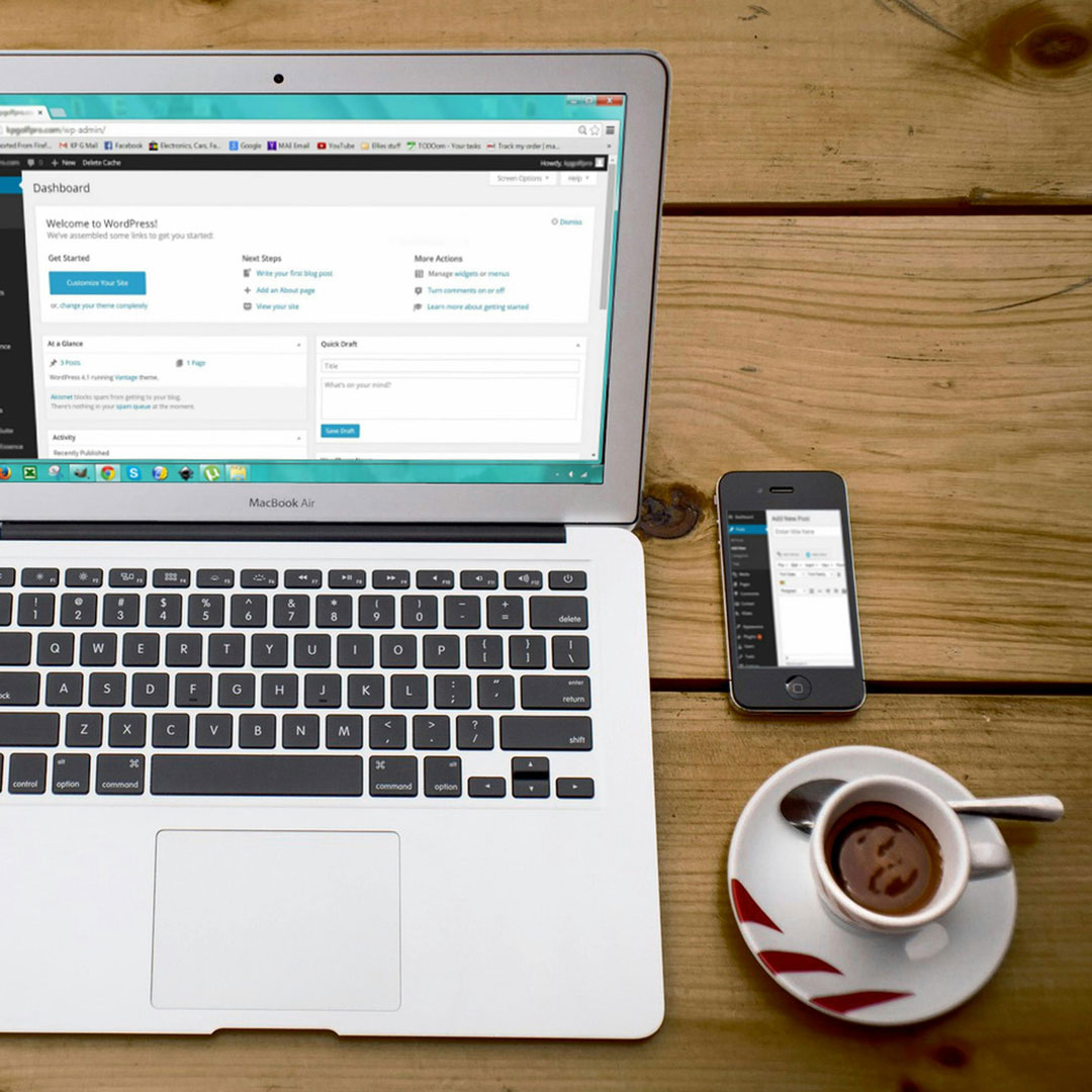 Professional UX/WebDev Services / Laptop on a table with a mobile phone and a coffee